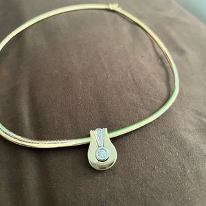 14 karat omega with 1/2 carat diamond pendant with 2 small diamonds